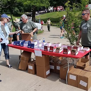 Strength for Service distributes 5,000 books at Memorial Day observance