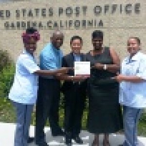 UM Men leader joins postal workers for food drive